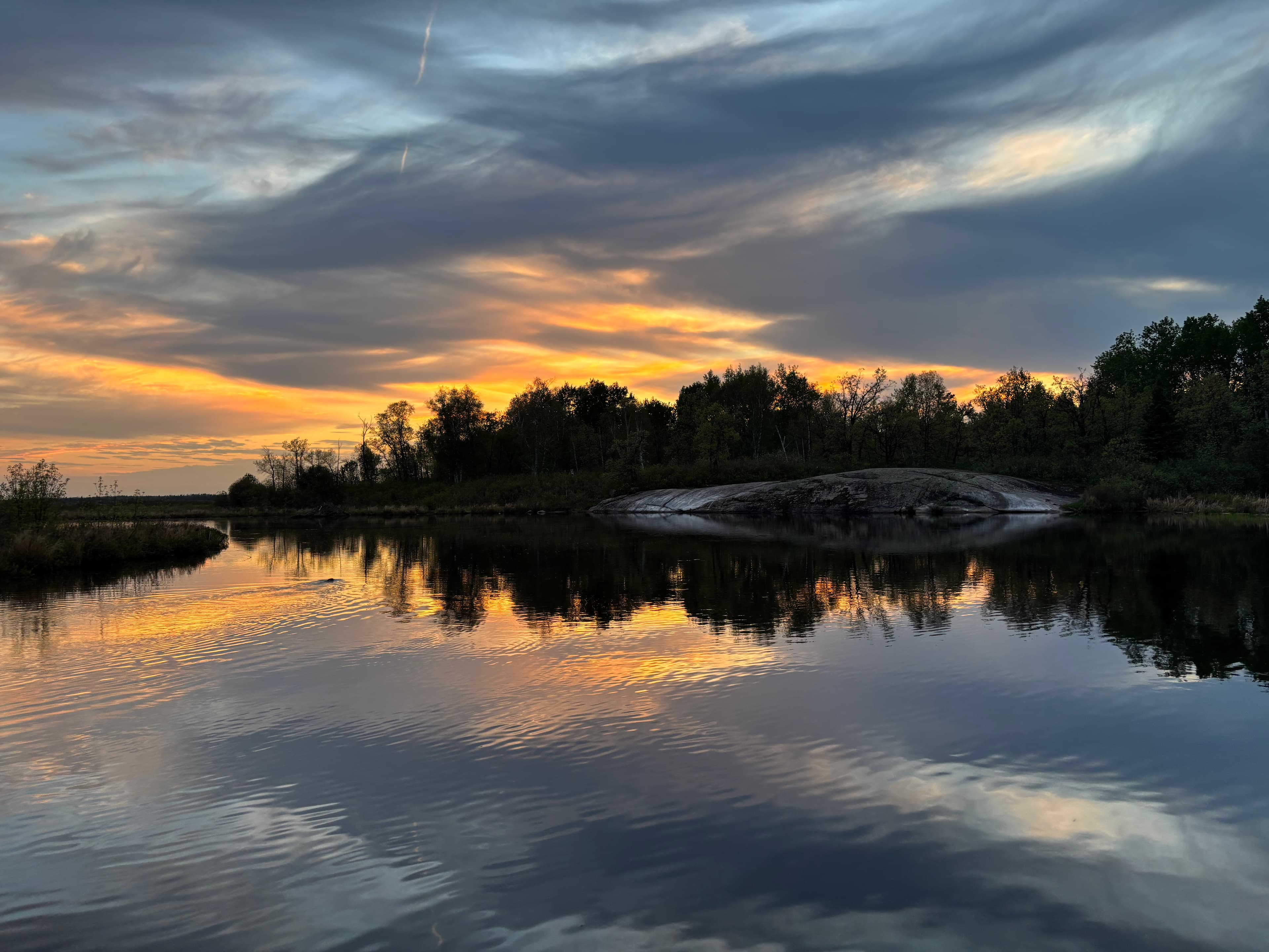 Sunset over Betula Lake with calm reflections on the water